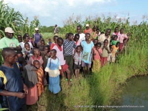 Sidonge people around water hole